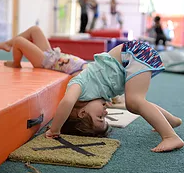 toddler doing gymnastics