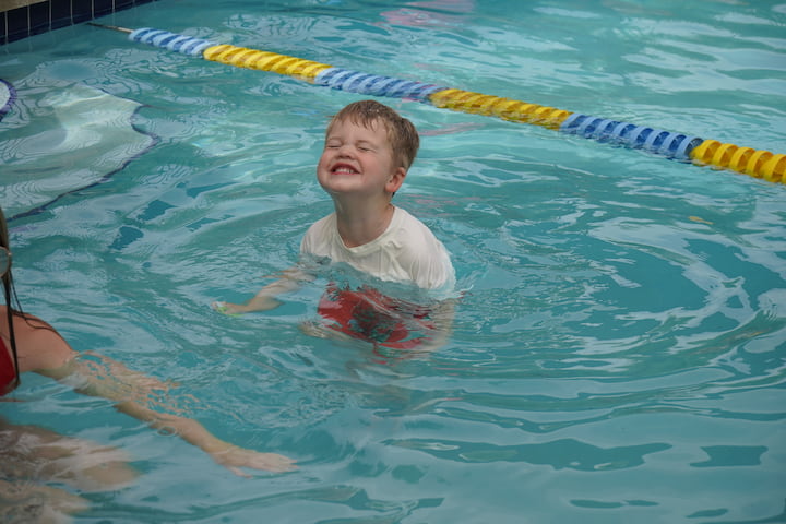 smiling boy in pool