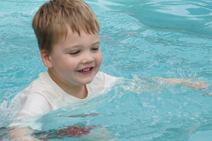 smiling boy in pool